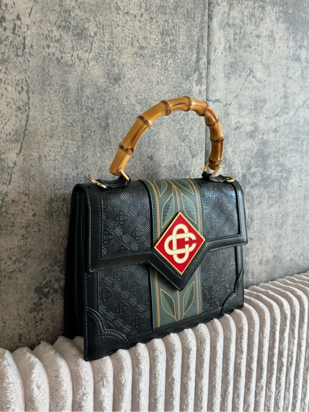 Black Satchel with Bamboo Top Handle and Green-Gold Stripe Accent